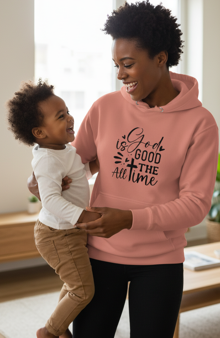MotherMindset Christian hoodie with "God is Good All the Time" slogan, mauve pink unisex pullover sweatshirt, front view.