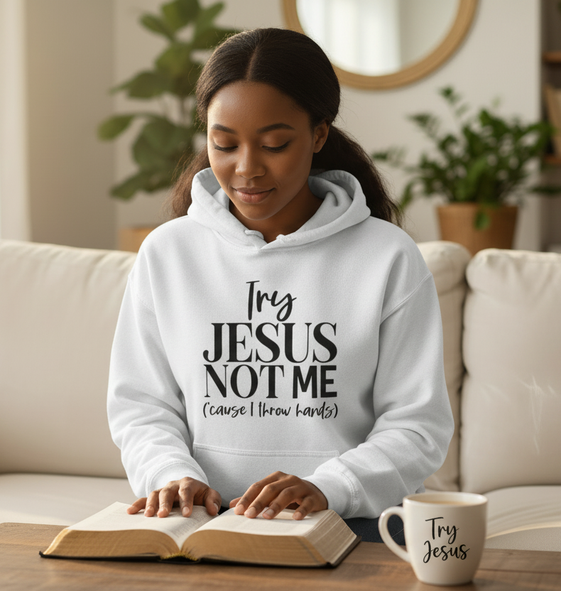 Unisex ash-colored hoodie with "Try Jesus Not Me" faith-based message and bold black text on the front.